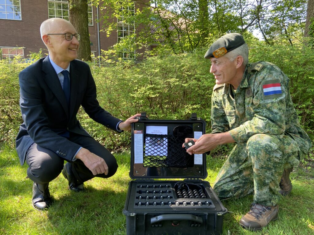 Evalan's CEO presents an ARMOR Heat Stress Monitor Flight Case to Brigadier General Roland de Jong